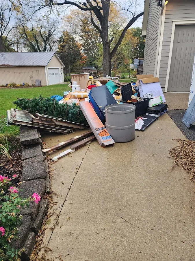 Dumpster being loaded with debris for Commercial Dumpster Rental in Tinicum